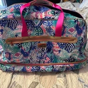 Lilly Pulitzer Paradise Bound rolling duffel bag.